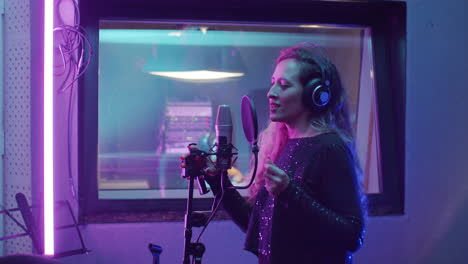 Woman-Recording-Song-in-Studio